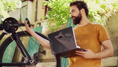 man using technology to repair bicycle