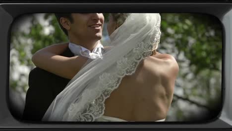 animation of happy couple on wedding day in forest on retro tv screen