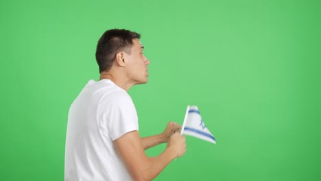 Rear view of a man waving a israeli pennant