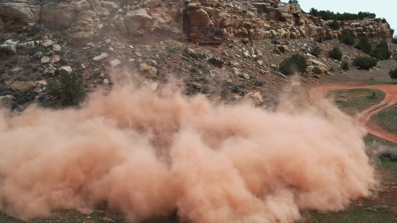 Massive Dust Cloud Engulfs Rocky Desert Landscape