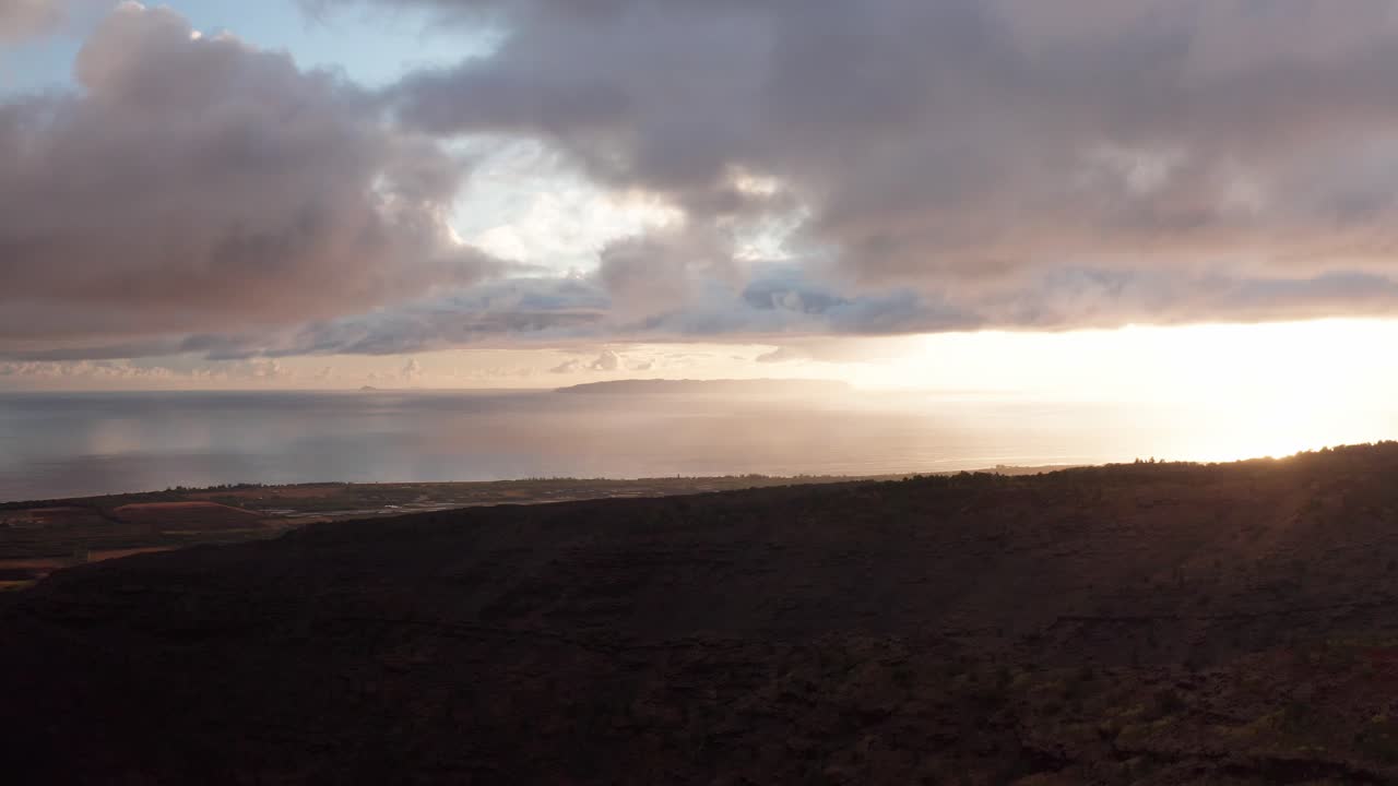 Wide panning aerial shot of Hawaiian island of Ni'ihau at sunset off the southern coast of Kaua'i, Hawai'i
