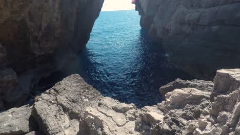 from low to high film sequence inside a rock formation in greece