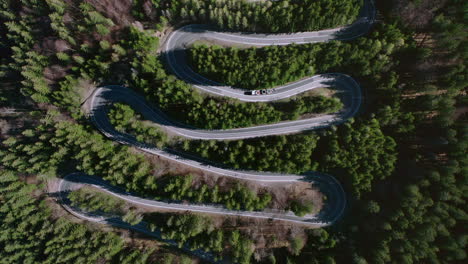 Aerial:-Bratocea-Pass-in-Romania,-winding-mountain-road-hairpins,-top-down-view