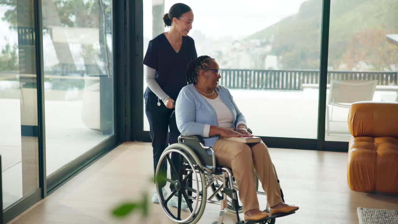 Smiling Caregiver Pushing Elderly Woman in Wheelchair Through Modern Home