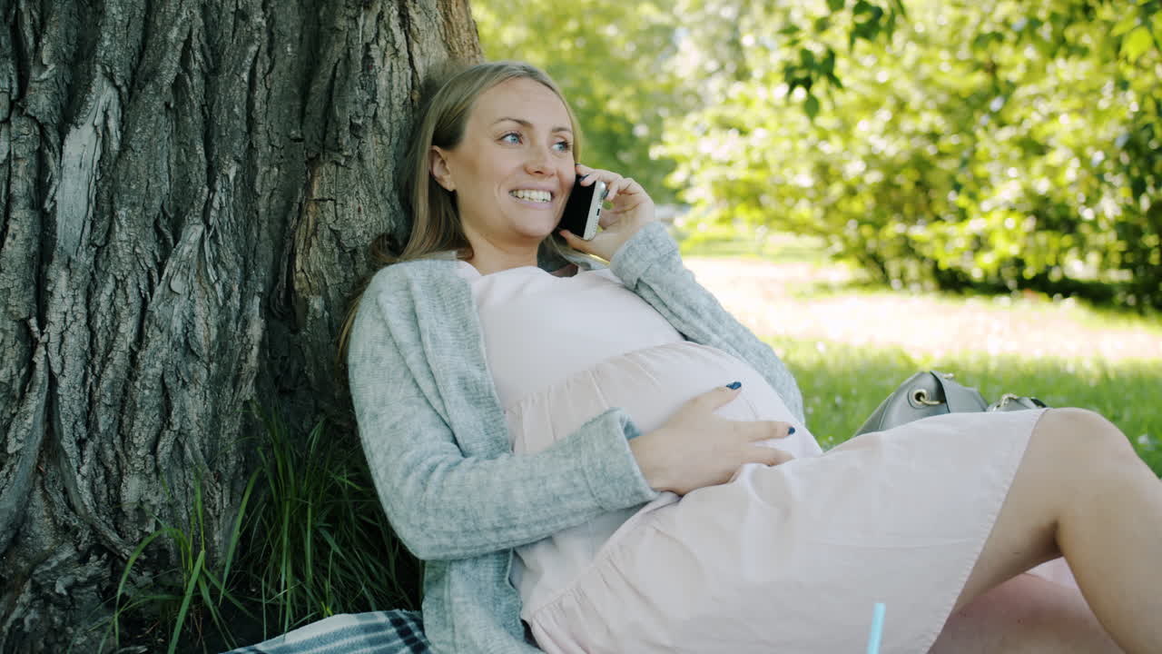 Pregnant Woman Relaxing in a Park