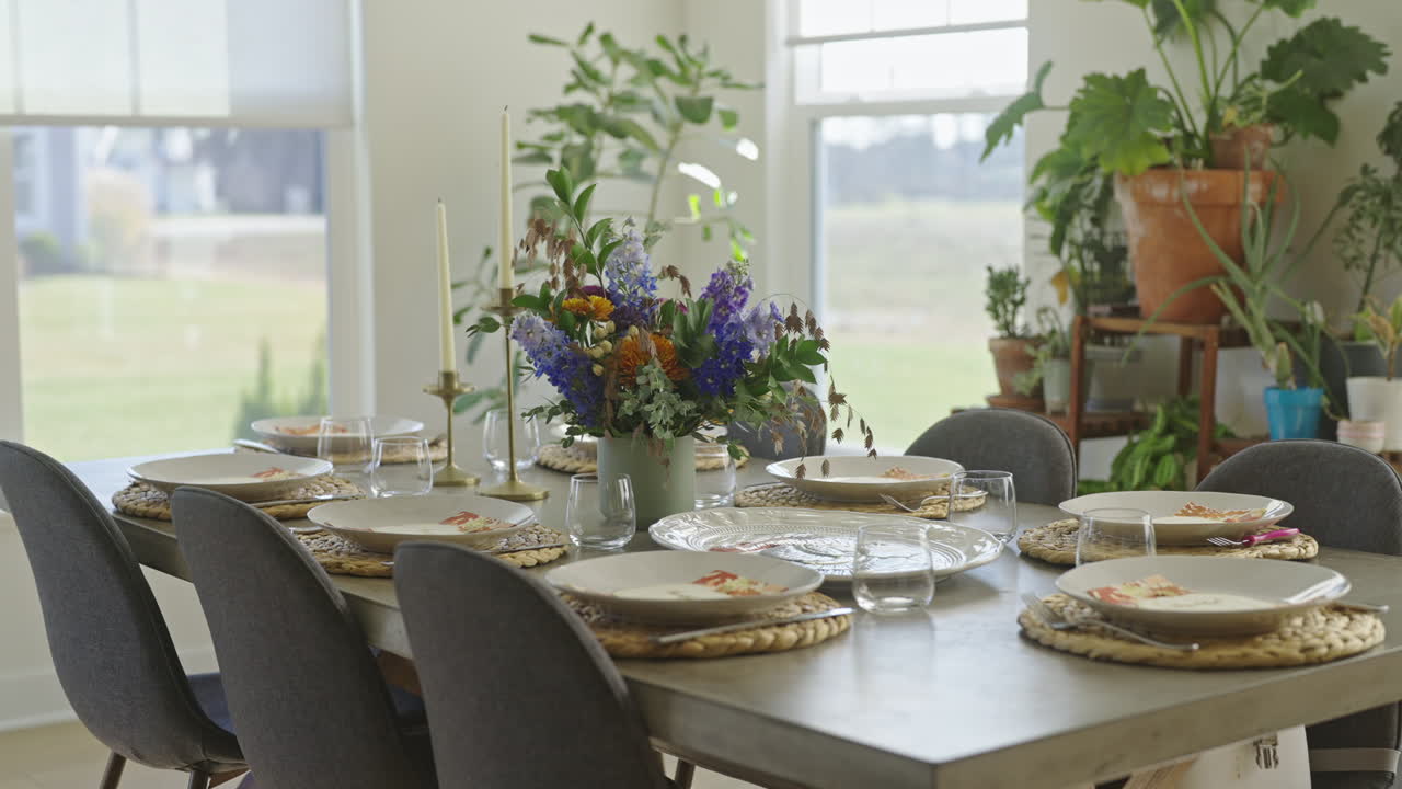 Elegant Dining Table Set with Floral Centerpiece in a Bright Room
