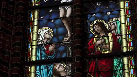 A-beautiful-stained-glass-window-featuring-figures-of-saints-in-a-church-in-Central-Europe,-captured-in-4K-resolution