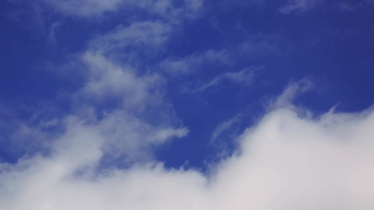Clouds at the sky, time lapse footage in 4K low angle view