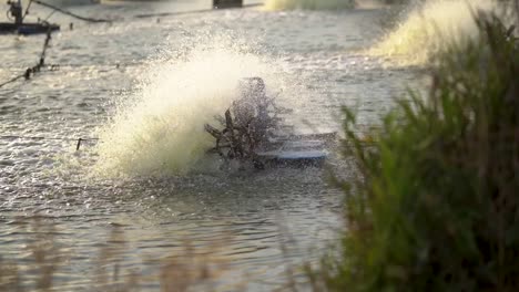 paddle wheel aerator in artificial lake of maagan michael, israel