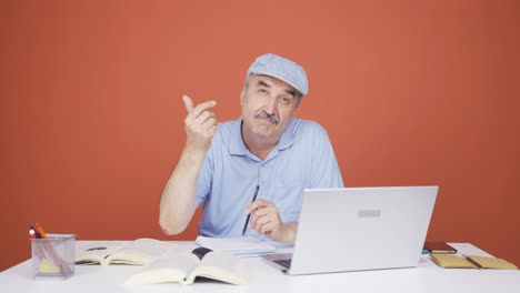 Old-man-making-money-sign-with-his-hands.