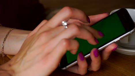 girl is using a mobile phone with green screen