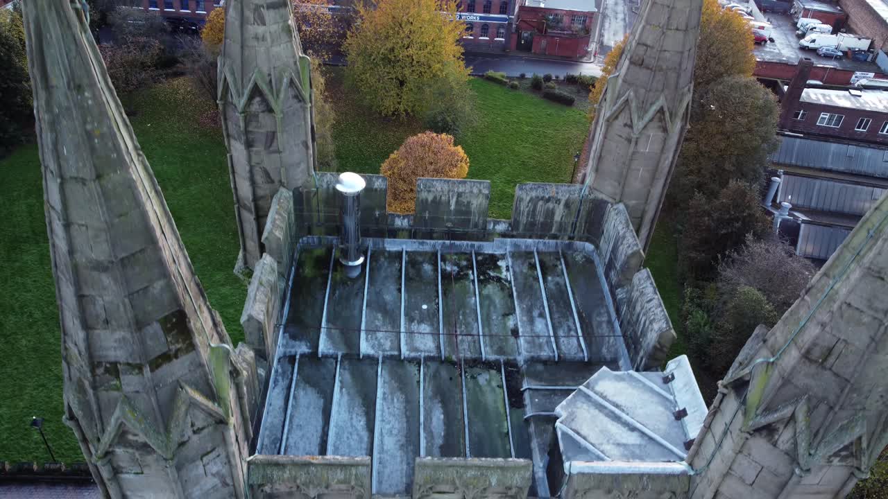 Aerial View of a Church Tower and Surrounding City in Autumn