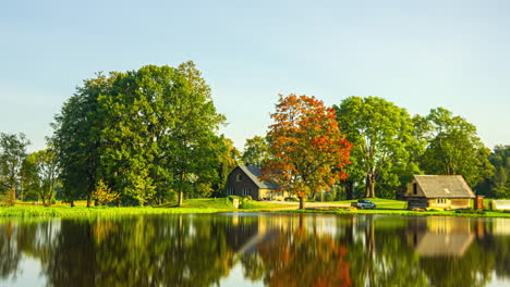 timelapse shot of wooden cottage throughout various seasons along rural countryside