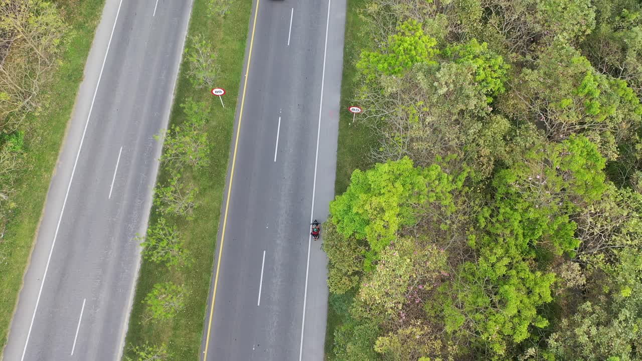 vehicle tracking video with drone. aerial shot with drone. national road video. traffic video. highway video. nature video right from the road.