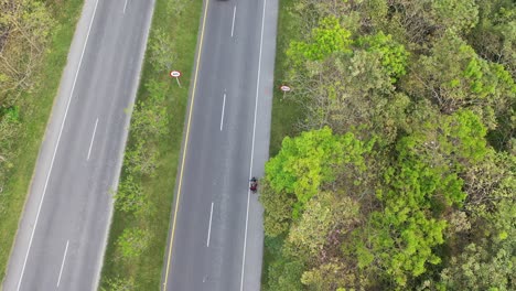 vehicle tracking video with drone. aerial shot with drone. national road video. traffic video. highway video. nature video right from the road.