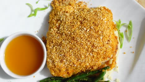 crispy breaded fish with green beans and sauce