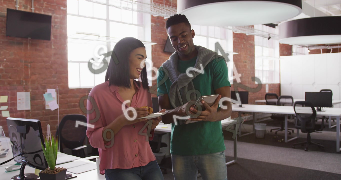 Coworker pair tasting pastry as swiping tablet in office generating data cloud for business insight