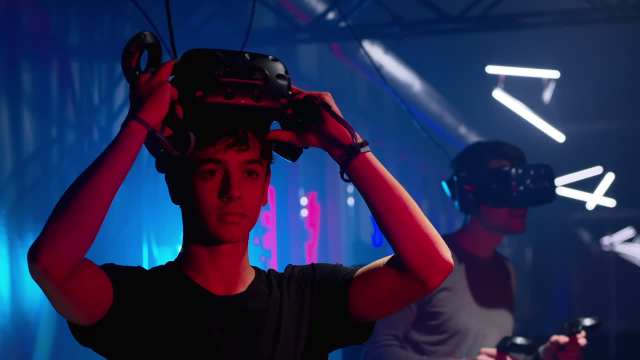 Boys playing with a Virtual Reality headset in a studio