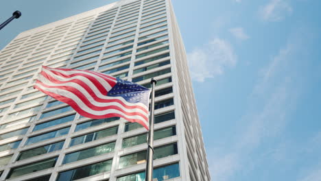 american flag on the background of the office building