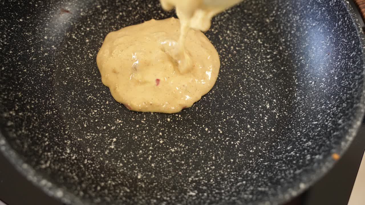 Pouring Pancake Dough on Frying Pan in Slow Motion, Extreme Close Up