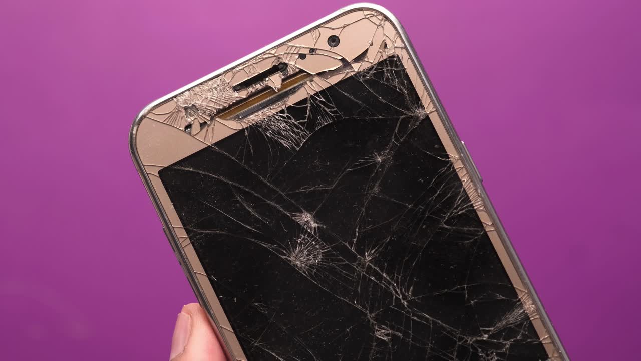 Broken Smartphone with Cracked Screen