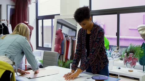 fashion designers working on table 4k