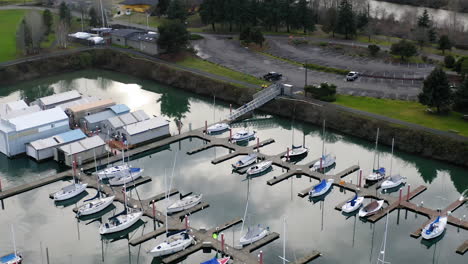 aerial view of a marina with numerous sailboats docked
