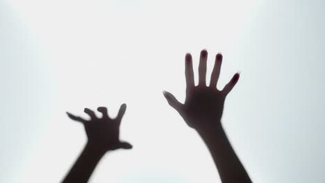 Hands Reaching Through a Translucent Surface
