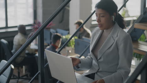 businesswoman on video call in modern office