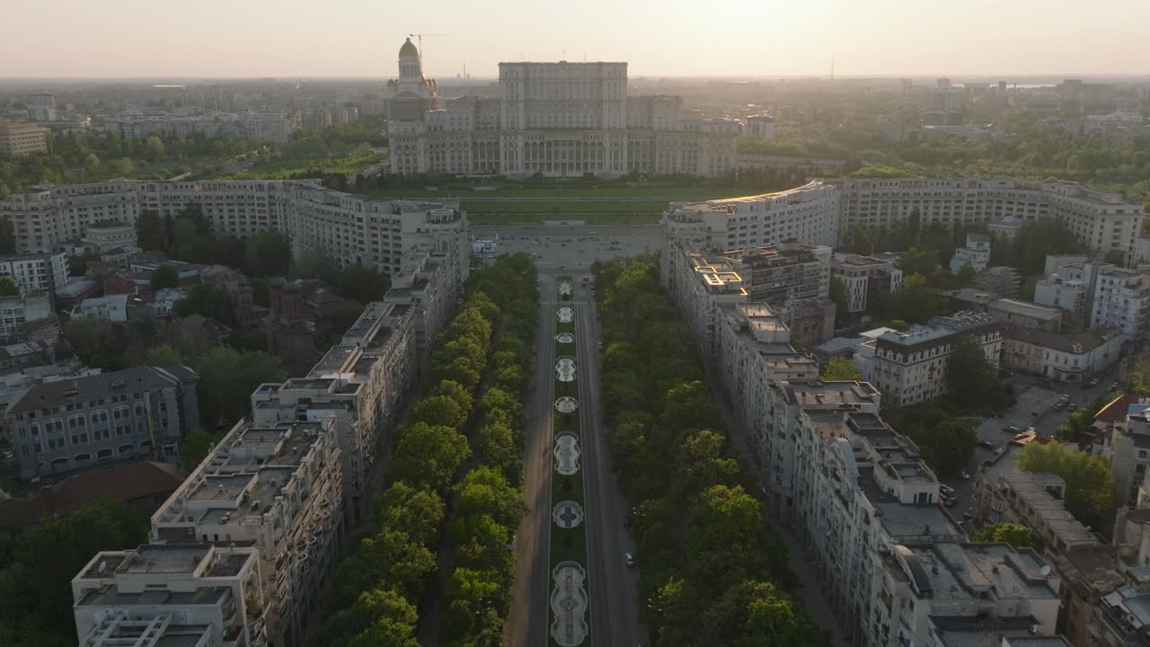 Aerial flight over road towards parliament building in Bucharest, romania