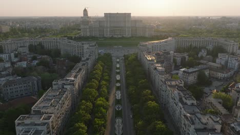 aerial flight over road towards parliament building in bucharest, romania