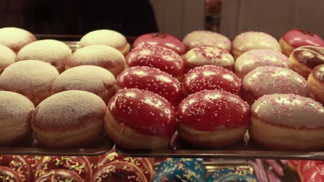 chocolate donuts display for sale at local store ,