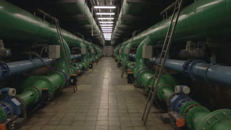 Illuminated-Industrial-Corridor-with-Pipes