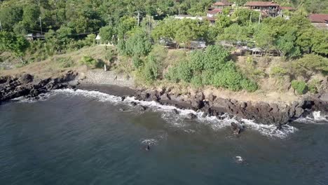 aerial shot of the beach with sedimentary rocks in bali