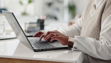 person typing on a laptop