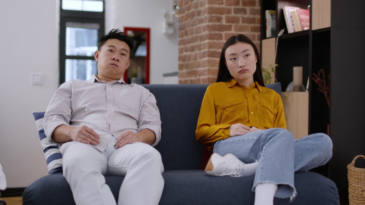 Couple Sitting on Couch