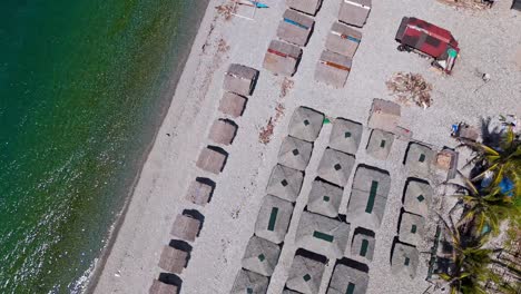 Overhead-Drone-View-of-Mabua-Beachfront-Huts-in-Surigao,-Philippines