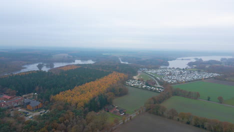 autumn season in germany with view of thülsfeld dam and forest landscape in mist