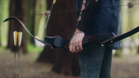 Archery-woman-loads-her-bow-medium-shot