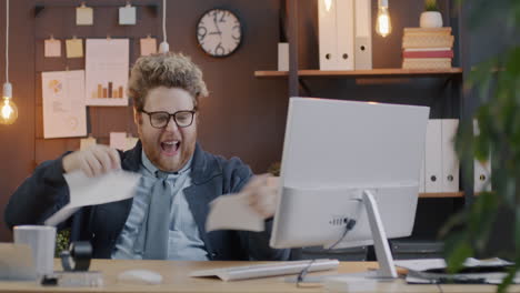 man shredding document in office