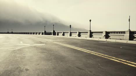 view of the bridge over the river in fog