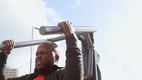 man exercising with shoulder press machine 4k