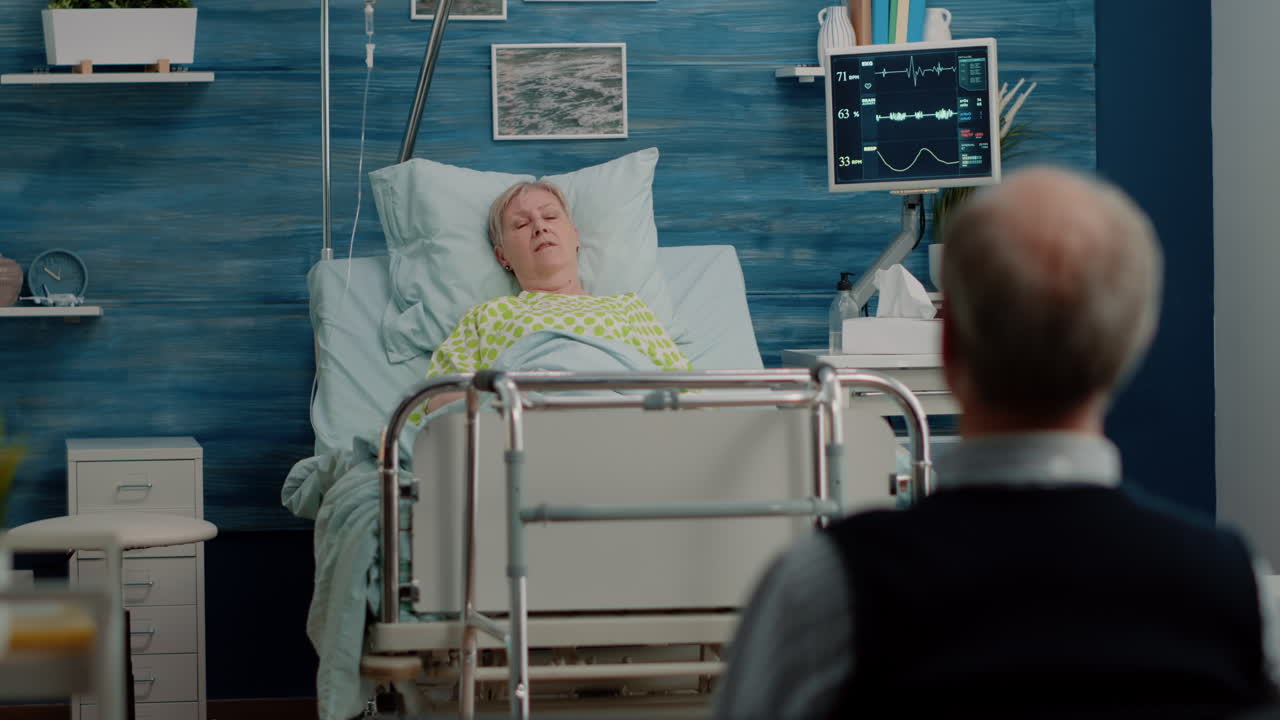 Old woman with disease resting in bed while talking to husband