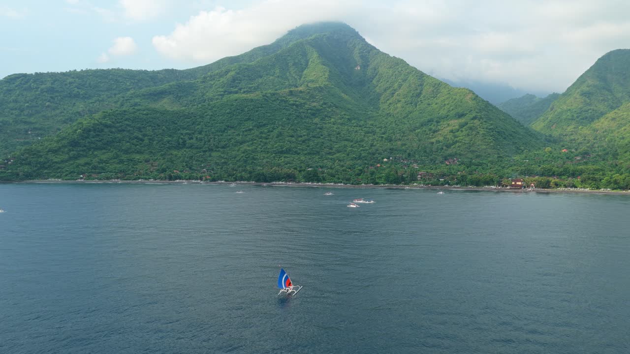 Traditional jukung boat sailing in amed, bali