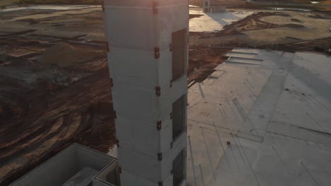 beautiful aerial view of a construction site and structural concrete elevator tower