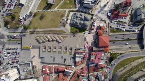 Aerial-view-of-a-highway-in-Skopje,-Macedonia,-showing-vehicles-driving-through-a-tunnel