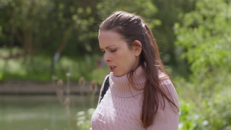 Stressed-Or-Angry-Woman-Outdoors-With-Financial-Worries-About-Cost-Of-Living-Crisis-Debt-And-Paying-Bills-Talking-On-Mobile-Phone-Walking-By-River-2