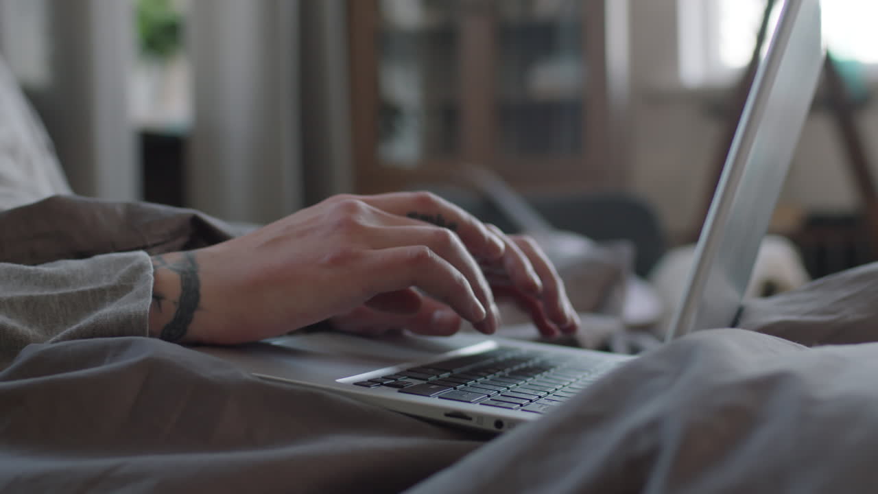 Tattooed Male Hands Typing On Laptop