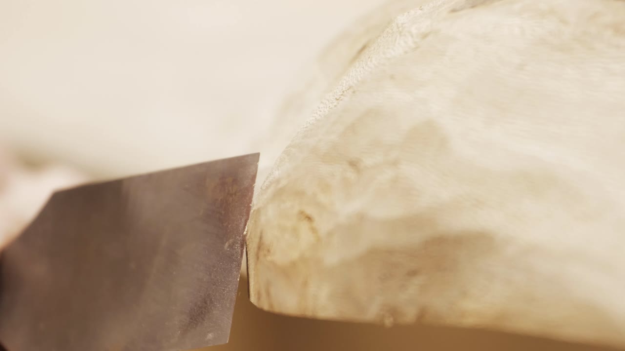 Close shot of a chisel on a wooden table