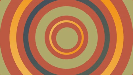 fondo animado abstracto con círculos concéntricos pulsantes de color verde y naranja y centro tembloroso